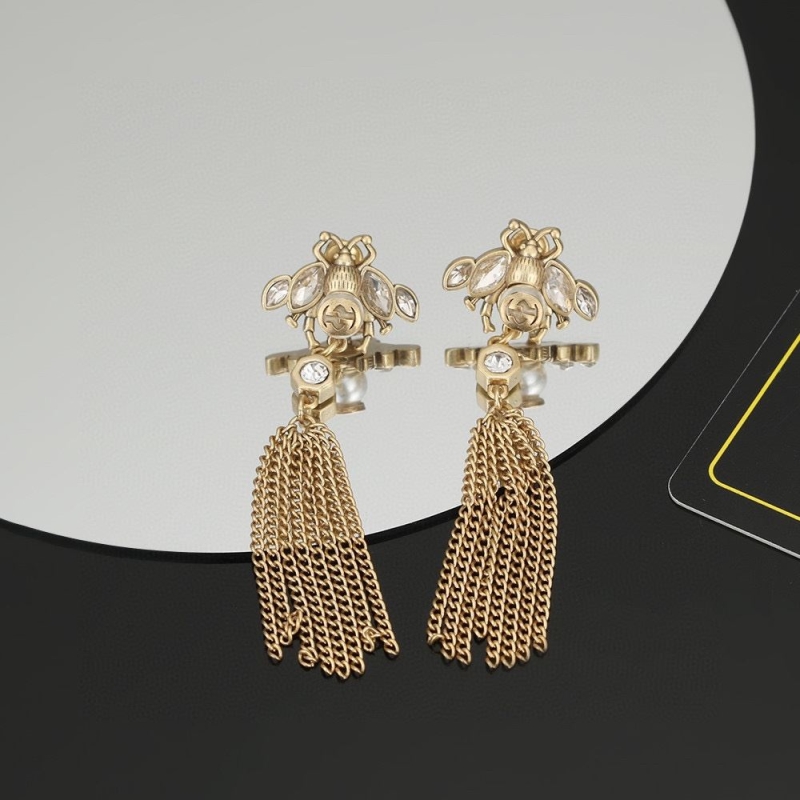G*u*i earrings